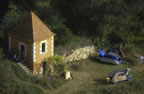 A 2CV enthusiast  below the perched village of Roussillon, Provence. (81kb)